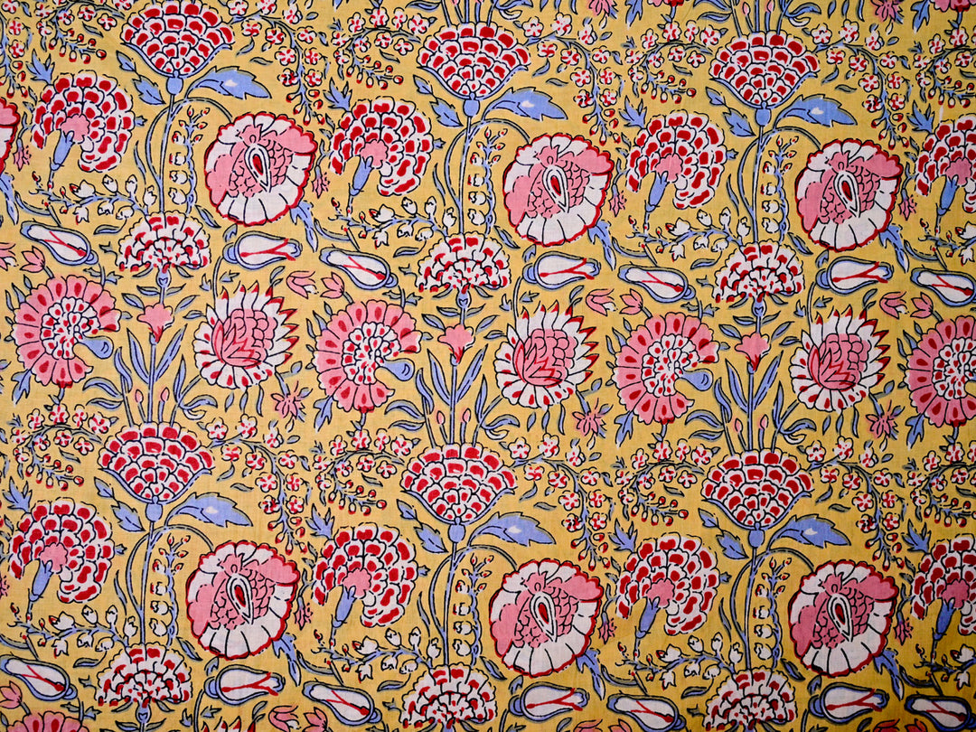 Modern red floral cotton fabric by the yard, perfect for clothing and home décor projects.