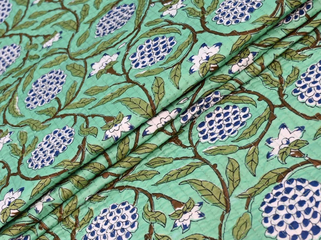 Indolibas mint green floral quilted cotton fabric with blue and white flower print