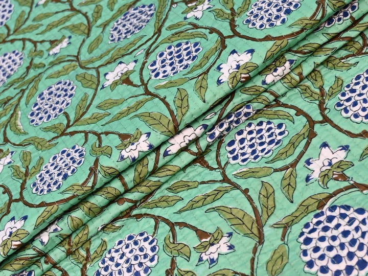 Indolibas mint green floral quilted cotton fabric with blue and white flower print