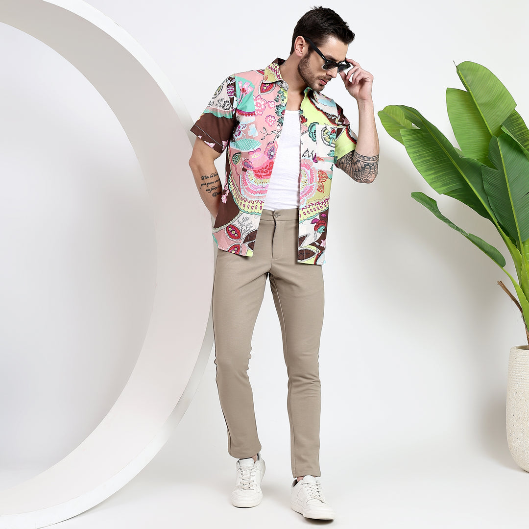 Classic button-down shirt with a tropical design, great for casual occasions.