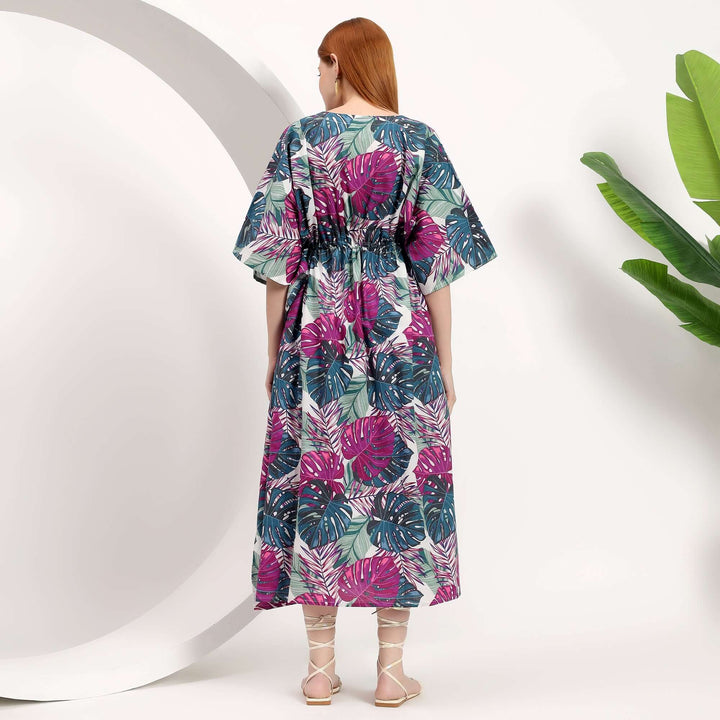 wholesale beach kaftan dress for women featuring colorful tropical floral patterns and a stylish back view.