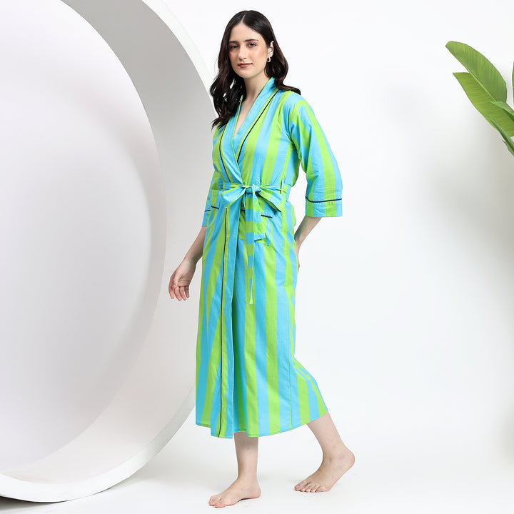 Side view of green striped nightgown with waist tie and long sleeves