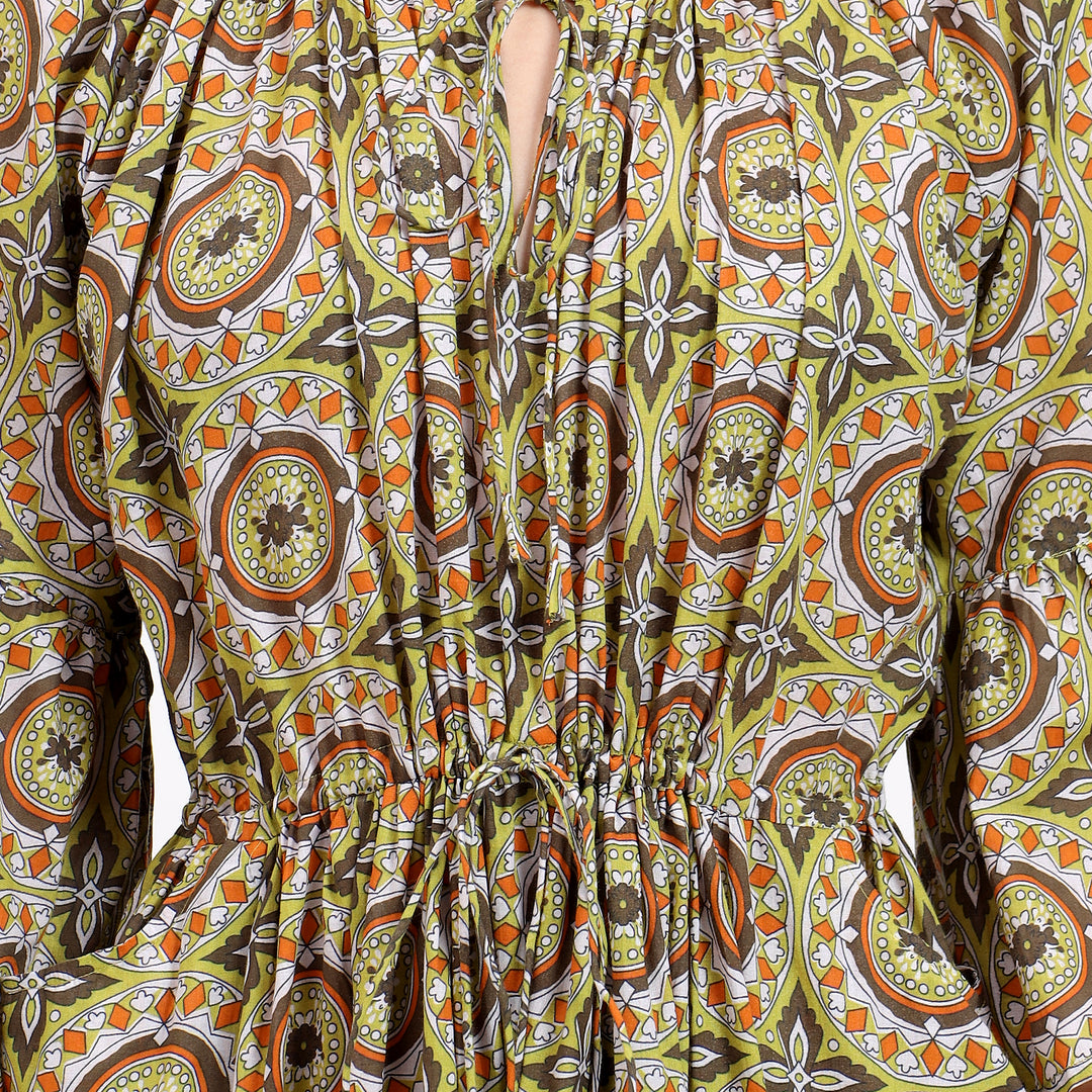 Close-up of the handblock prints on the Claudia Mustard Cotton Maxi Dress, highlighting its intricate patterns and vibrant mustard color.