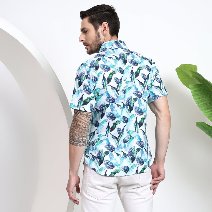 Detail view of a men's classic fit shirt with a tropical floral design in bright colors