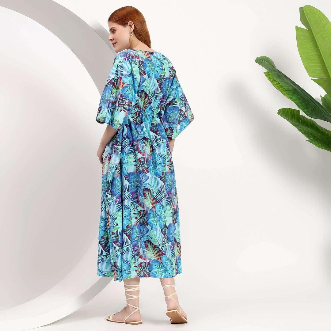 Plus size caftans wholesale beach cover-up in vibrant tropical print, showcasing a relaxed fit and stylish design.
