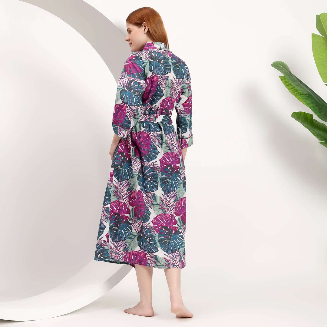 Back view of a woman wearing a wholesale tropical print kimono with vibrant floral patterns.