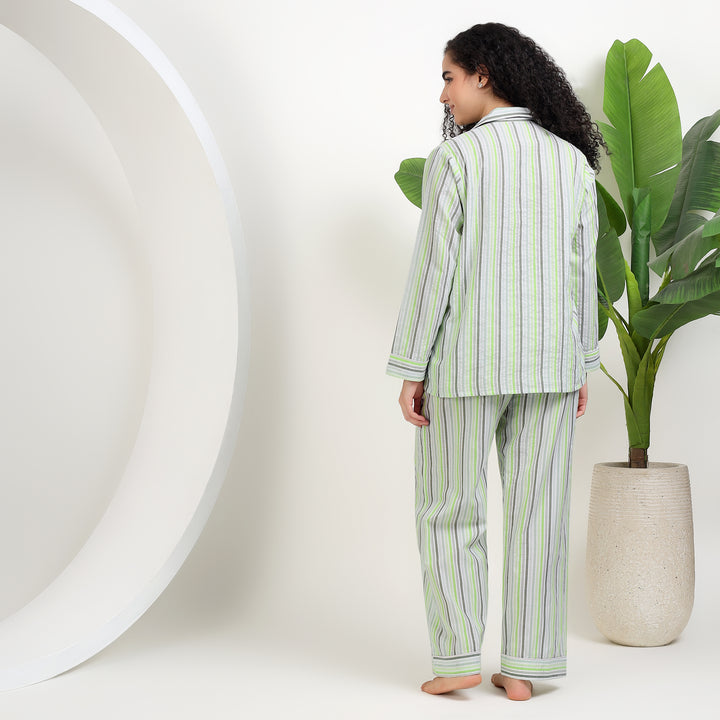 womens family matching cotton striped pajamas showcasing a woman in stylish striped sleepwear from the back.