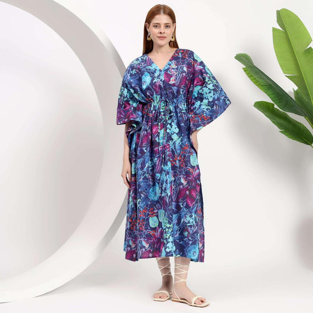 Floral abaya wholesale caftan dress showcased on model in vibrant blue and purple floral print.