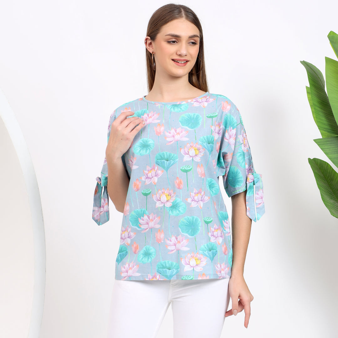 Floral print light blue top, perfect for pairing with skirts, jeans, or trousers.