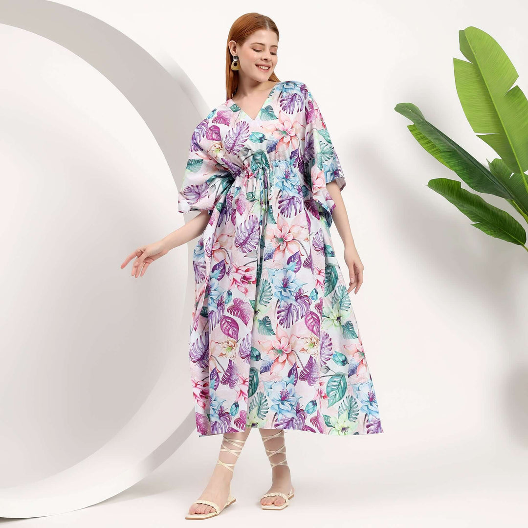 Model wearing a colorful wholesale summer caftan for small shops with floral patterns, perfect for warm weather.