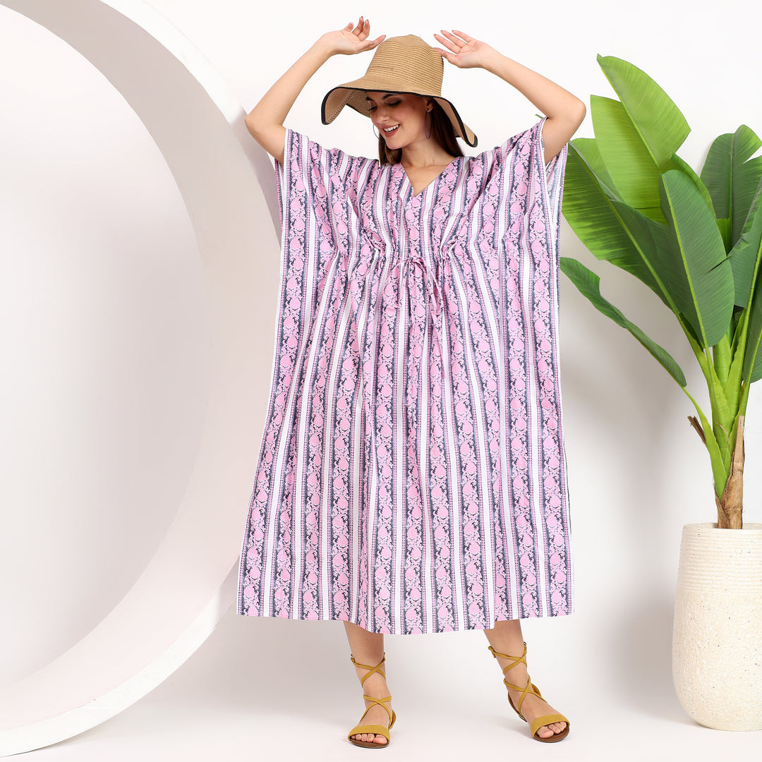 Flowy hem detail of a striped plus-size kaftan dress for women, highlighting its lightweight and breathable material