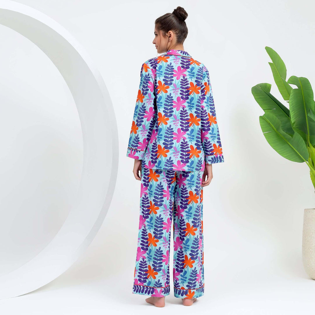 Back view of a woman wearing a Handmade Indian Pajama PJ Set with a vibrant tropical leaf print.