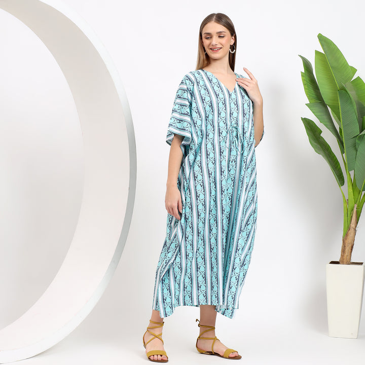 Flat lay of striped cotton kaftan dress highlighting soft fabric and elegant waist tie-up for versatile wear