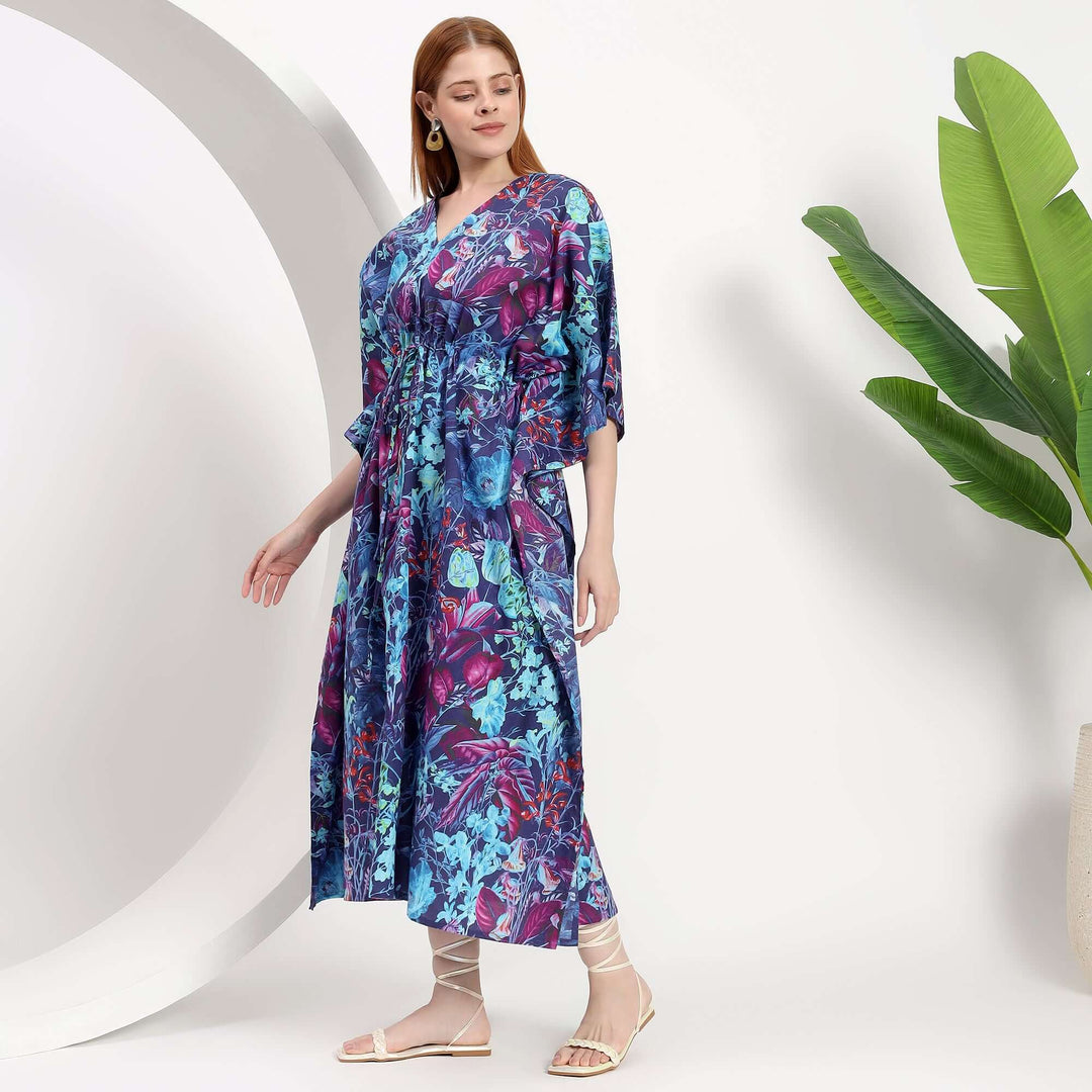 Floral abaya wholesale caftan dress showcased by a model in vibrant colors and relaxed silhouette against a minimal backdrop.