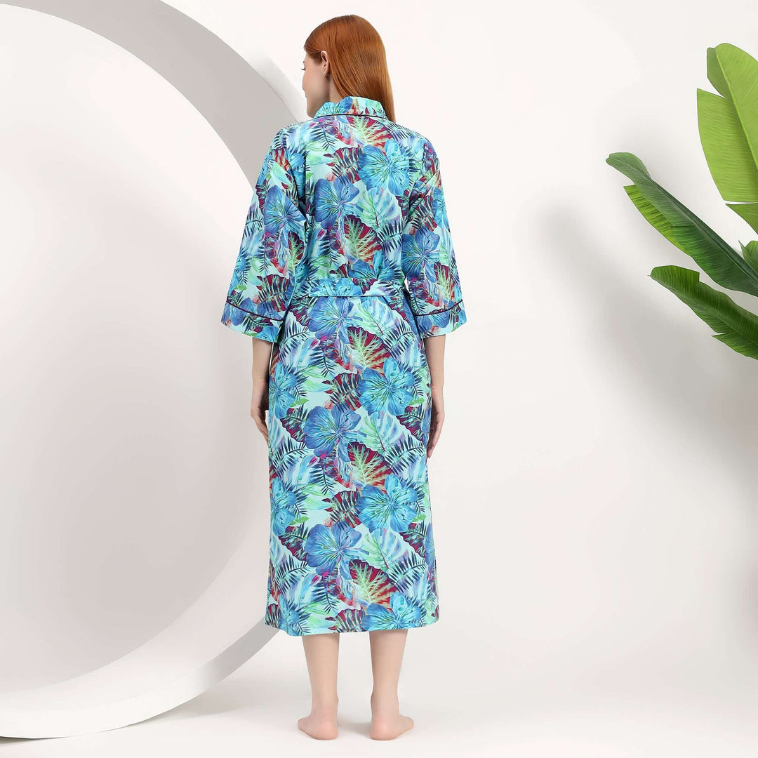 Back view of a woman wearing a wholesale floral dressing gown with a colorful tropical print.
