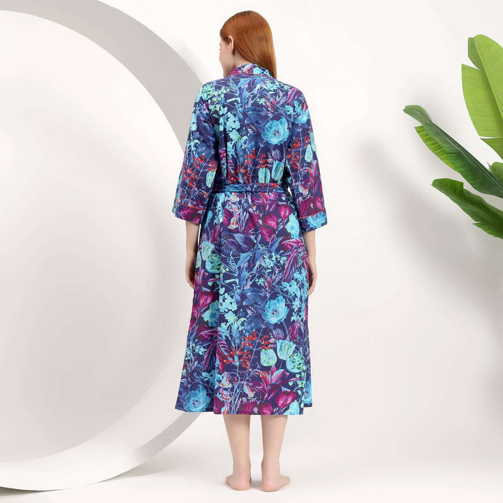Back view of a woman wearing a Floral Japanese Kimono Bathrobe with a vibrant floral design.