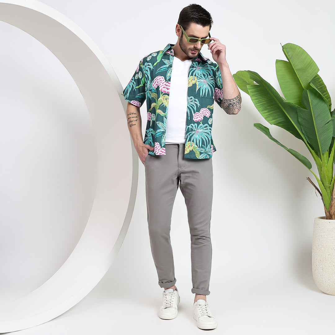 Button-down Hawaiian shirt worn over a white T-shirt for a stylish twist