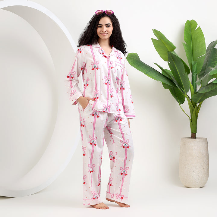 Women's Organic Cotton Holiday Pajama Set in White & Pink Bow Print, featuring a stylish and comfortable design.