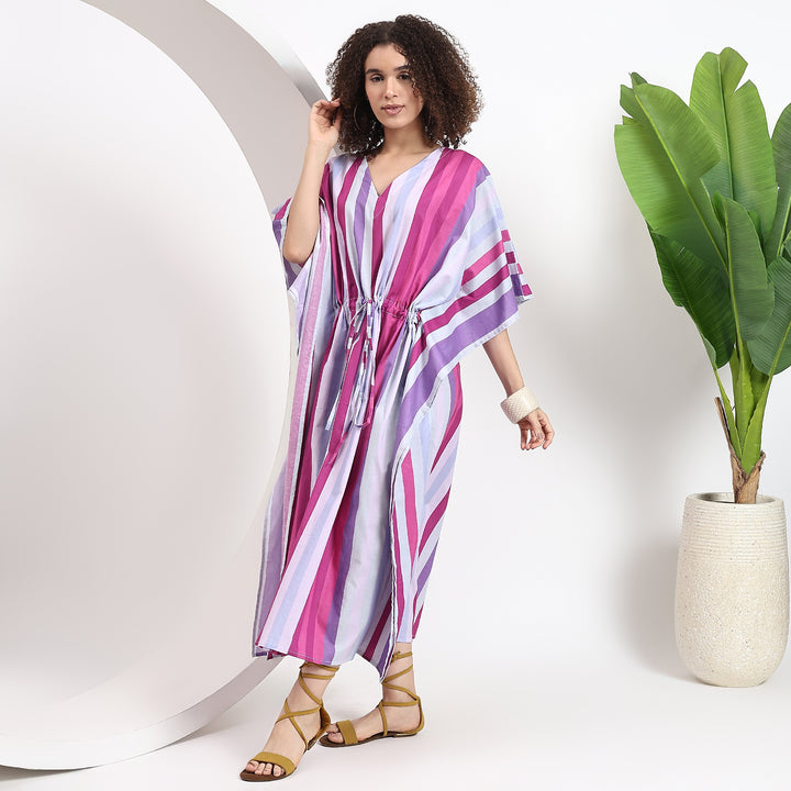 Pink kaftan dress highlighting an adjustable waist tie for a flattering fit and stylish touch.