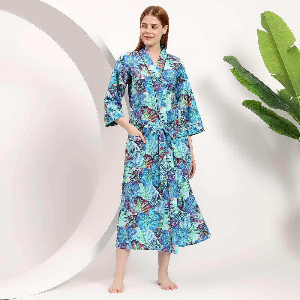 A model wearing a wholesale floral dressing gown, showcasing vibrant tropical patterns in a comfortable, stylish design.