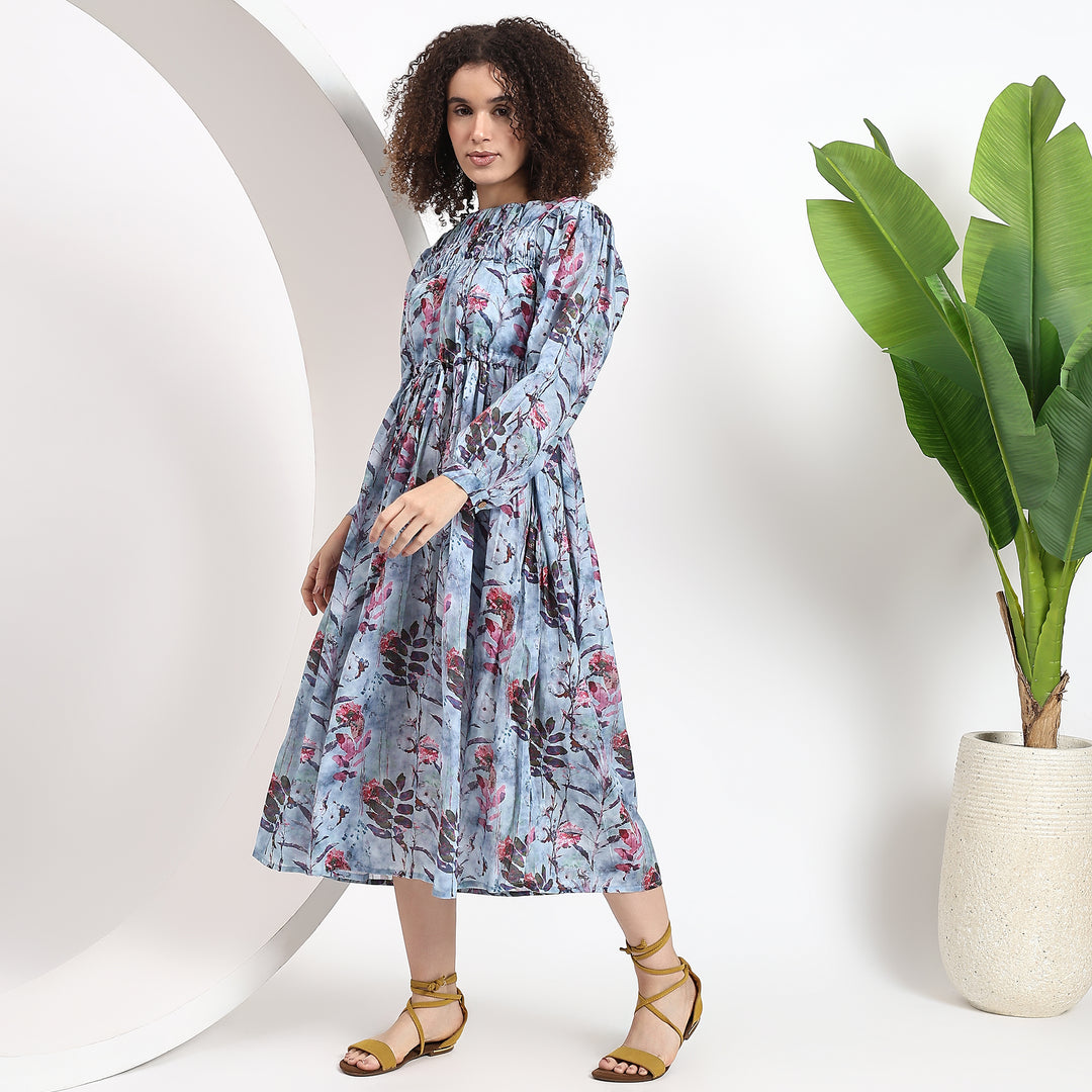 Stylish A-line dress in pastel floral print, featuring a shirt collar and long sleeves for versatile styling.