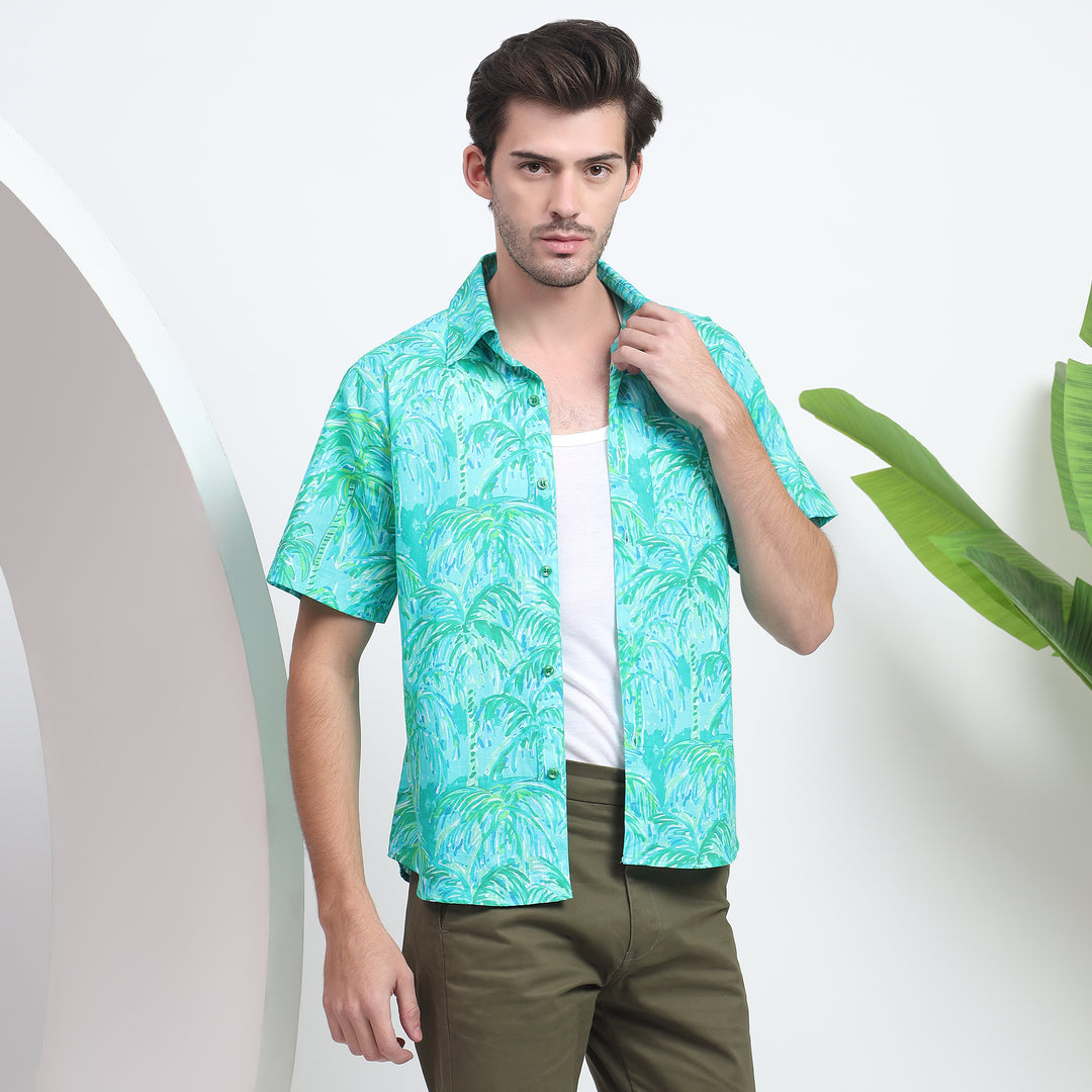 Stylish blue tropical print Hawaiian shirt for men’s beach outfit.