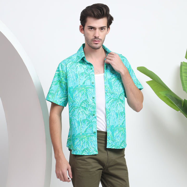 Stylish blue tropical print Hawaiian shirt for men’s beach outfit.