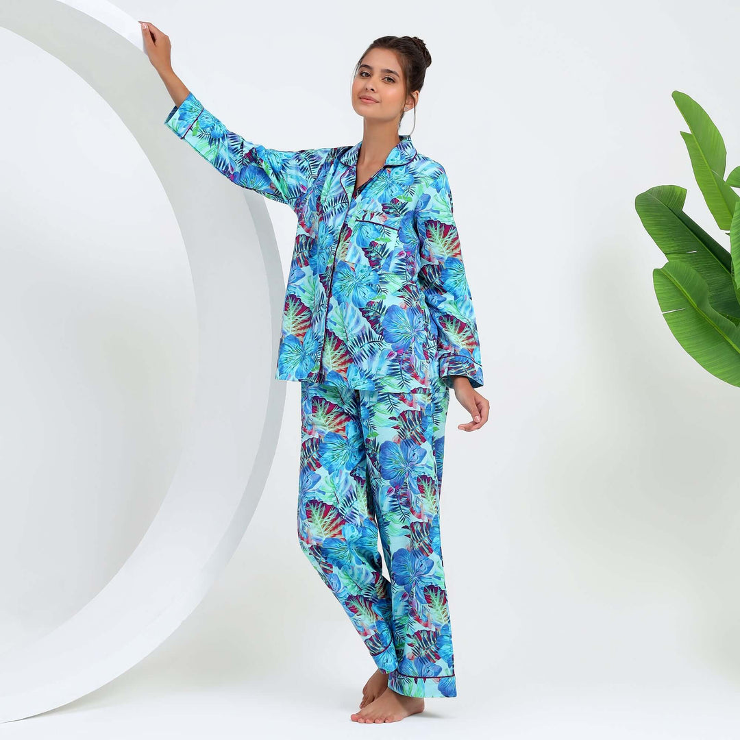 tropical floral cotton pajamas for women featuring a vibrant floral leaf print in blue and green.
