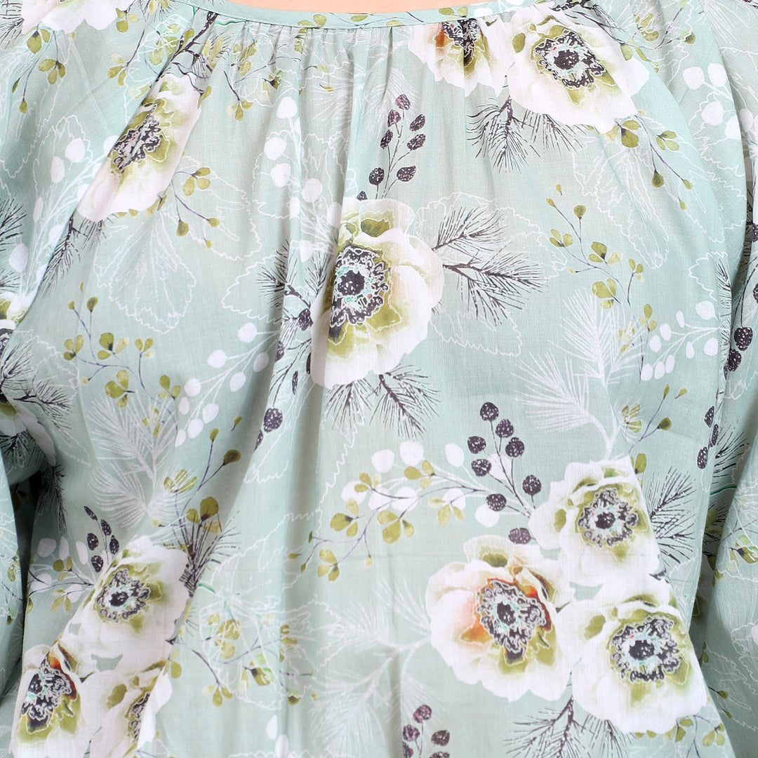 Detailed view of the smocked waist and floral print for a trendy and comfortable look