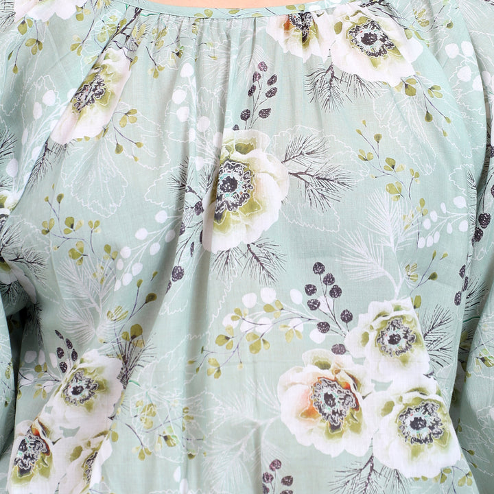 Detailed view of the smocked waist and floral print for a trendy and comfortable look