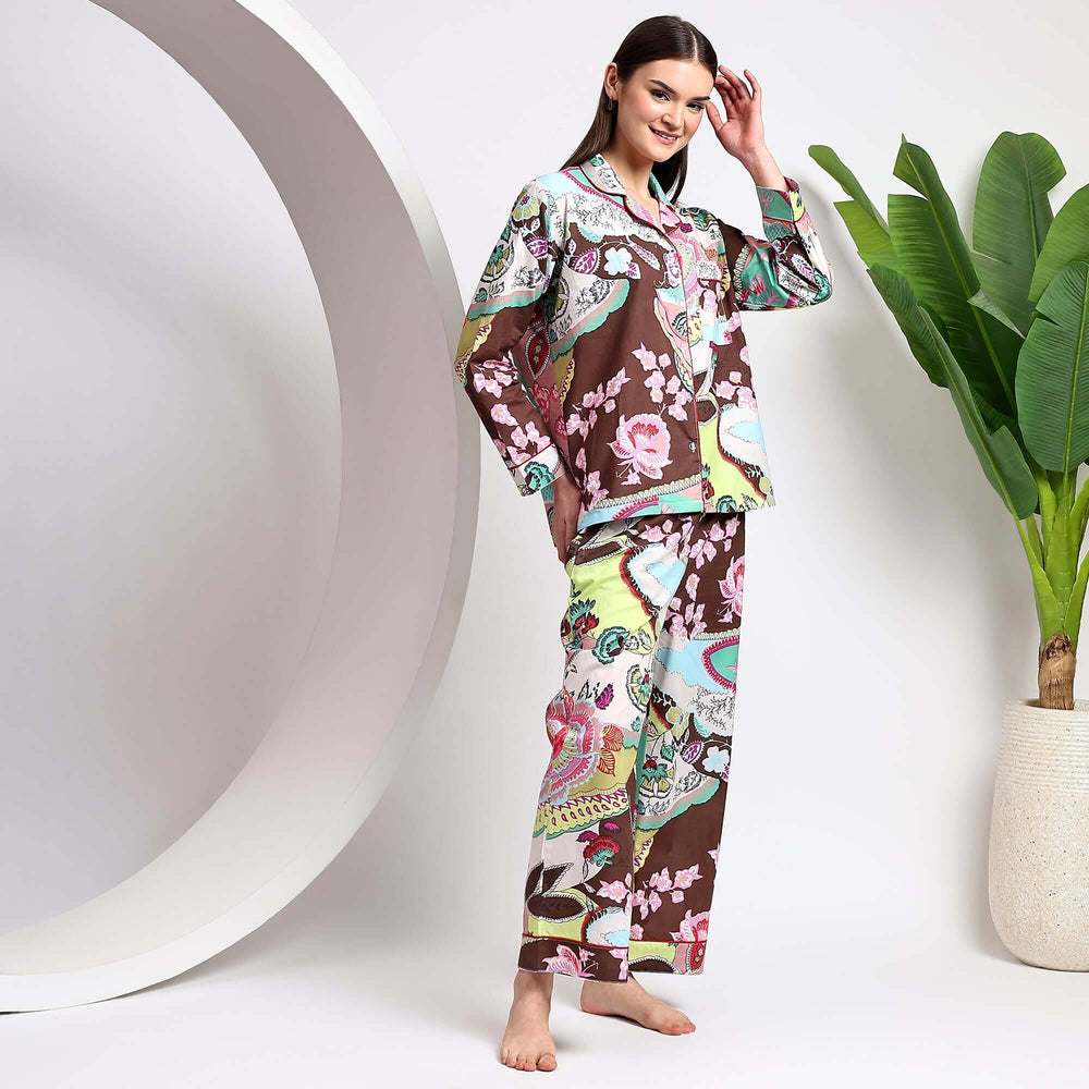Block print cotton pajamas for women featuring floral prints, modeled by a woman in a cozy indoor setting.
