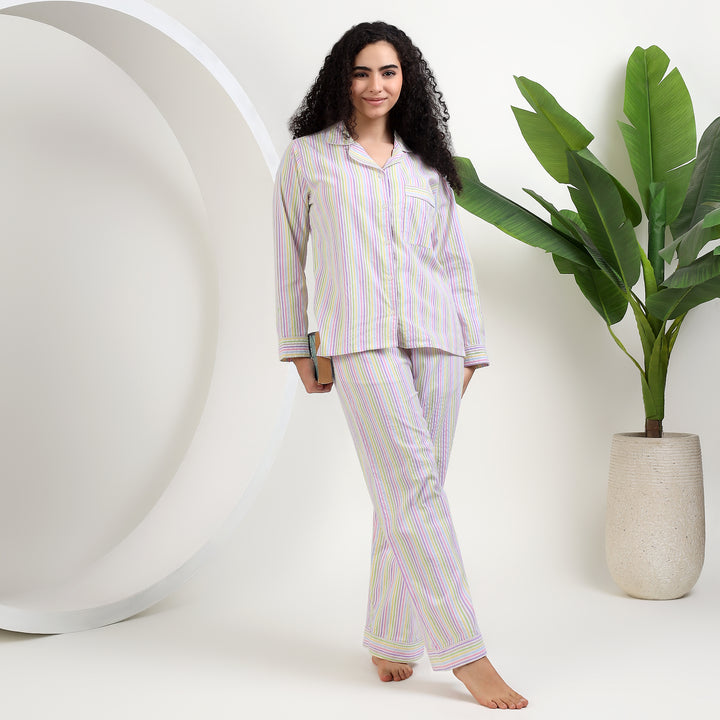 womens soft cotton pajamas for famaly matching thin striped design model wearing in a cozy setting