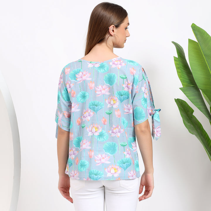 Light blue floral top, a stylish piece to wear with trousers or skirts for any occasion