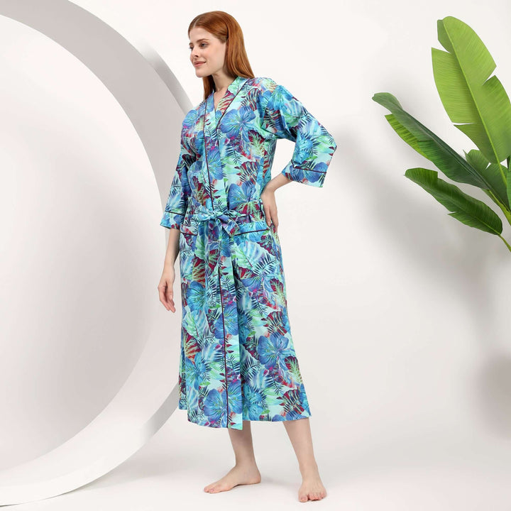 Woman wearing a wholesale floral dressing gown with a colorful floral pattern, showcasing comfort and style.