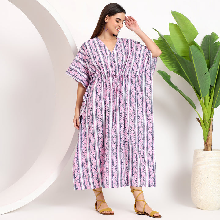 Top view of a striped kaftan dress with a wide neckline, perfect for plus-size women seeking trendy and versatile options