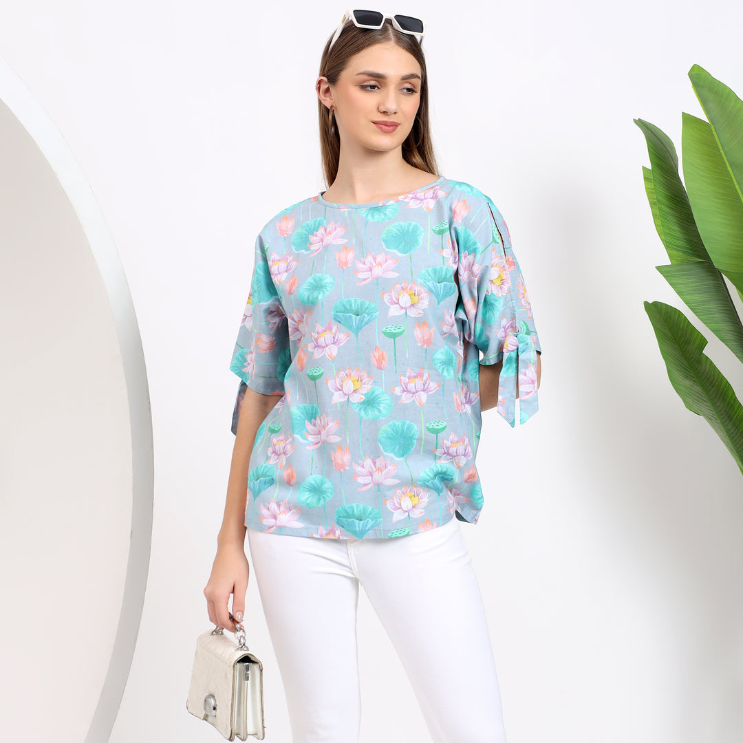 Soft light blue floral top, great for both casual and professional settings.