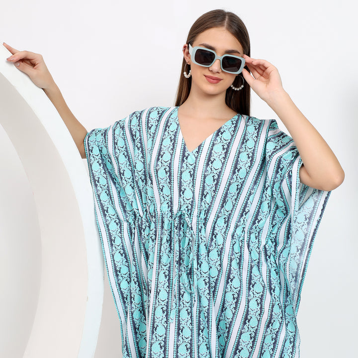 Sleeve detail of cotton striped kaftan dress with airy fabric for a breathable, lightweight summer outfit