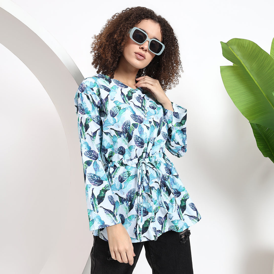 Relaxed-fit women’s top with leaf print, tie waist, and full sleeves