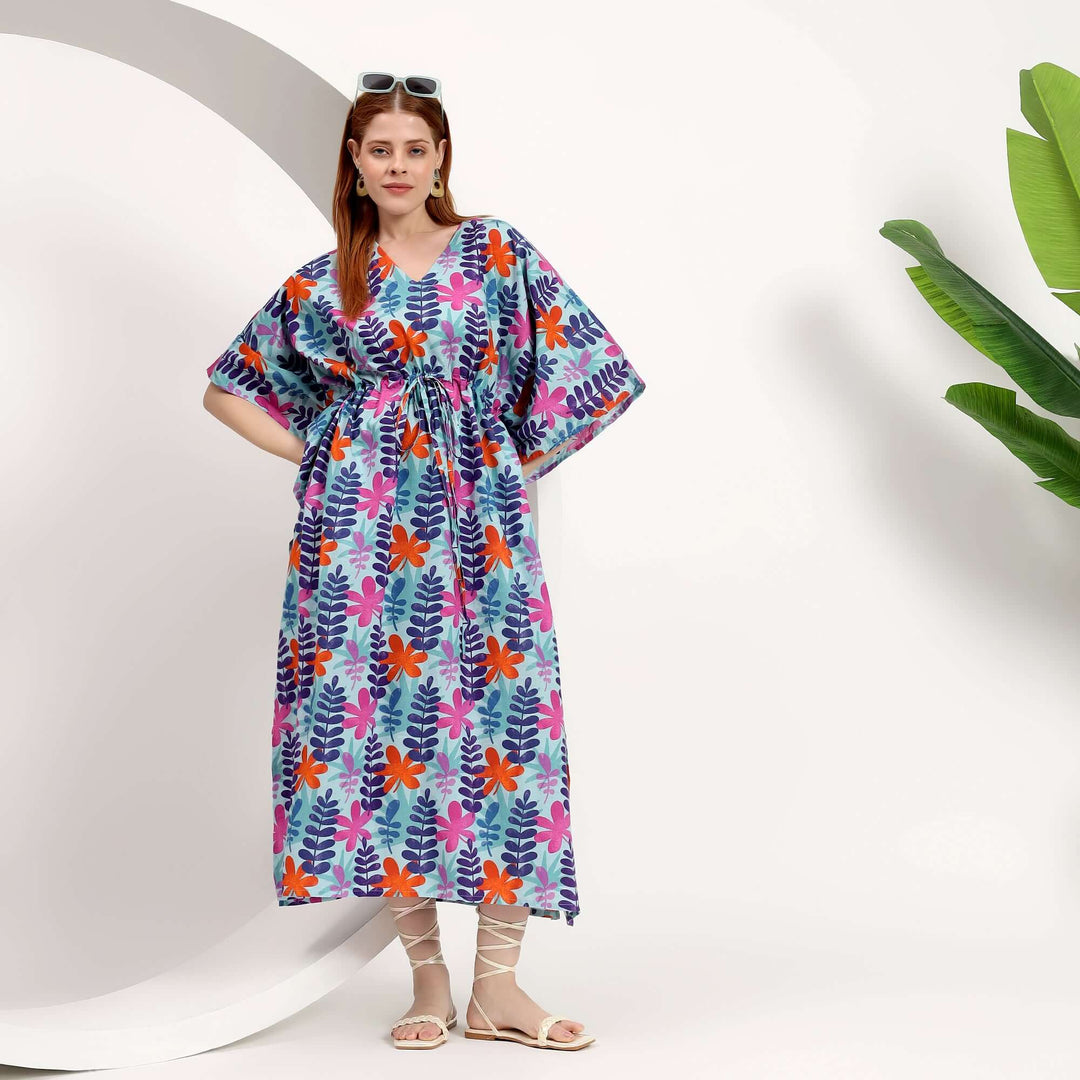 Wholesale Moroccan kaftan dress featuring vibrant floral patterns and a relaxed fit, ideal for warm climates.