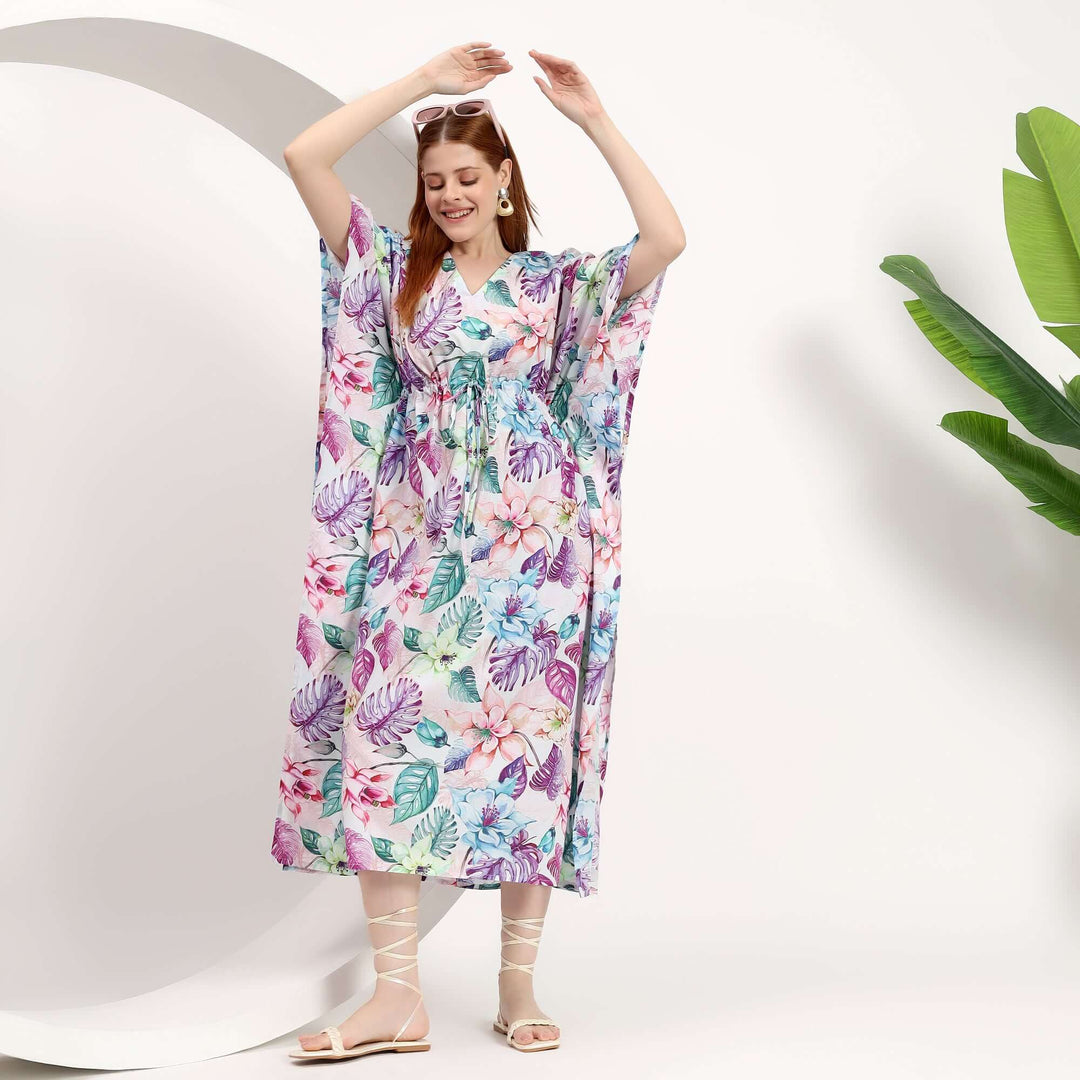 wholesale summer caftan for small shops worn by a smiling woman in a floral design, perfect for warm weather styles.