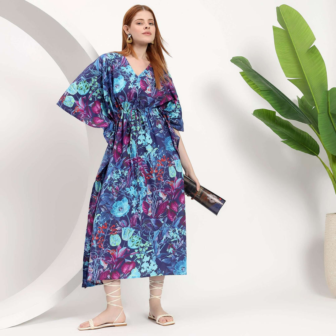 Floral abaya wholesale model wearing a colorful caftan dress, showcasing its relaxed silhouette and floral design.