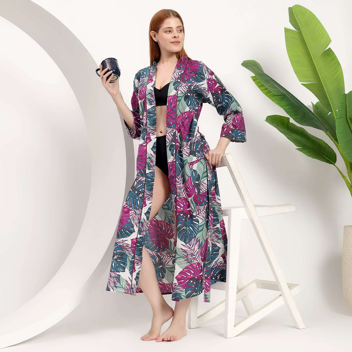 wholesale tropical print kimono worn by a woman, featuring vibrant leaf patterns, ideal for beach and resort wear.