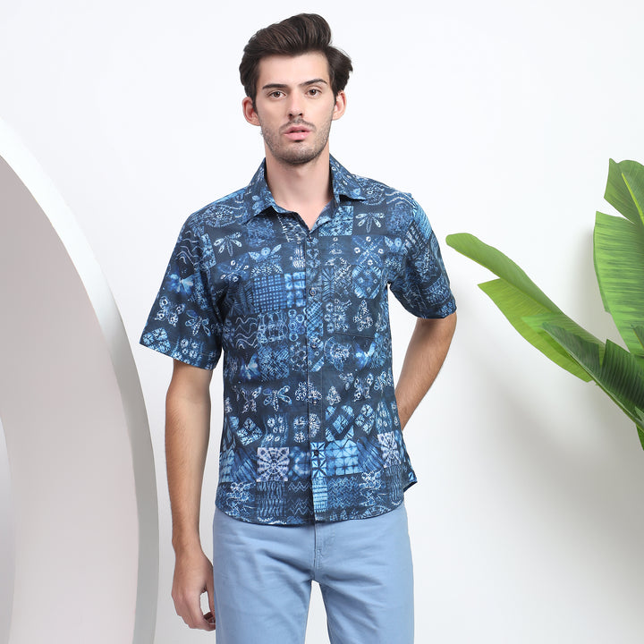 Handmade blue shirt with detailed printed patterns, offering a modern twist on classic craftsmanship