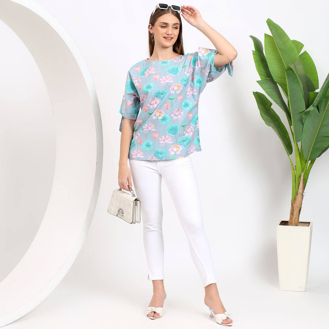 Light blue floral top, designed for casual or office wear, with a stylish, feminine print.