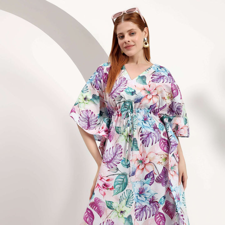 wholesale summer caftan for small shops model wearing floral print caftan with sleeves against a minimal background