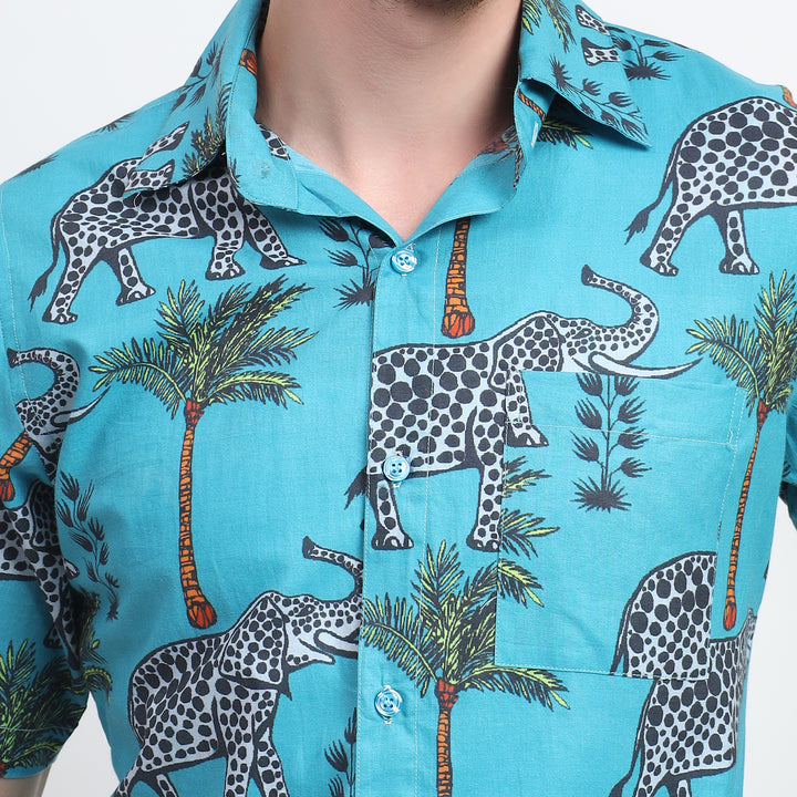 Blue cotton summer shirt with grey elephant print, short sleeves, and front pocket