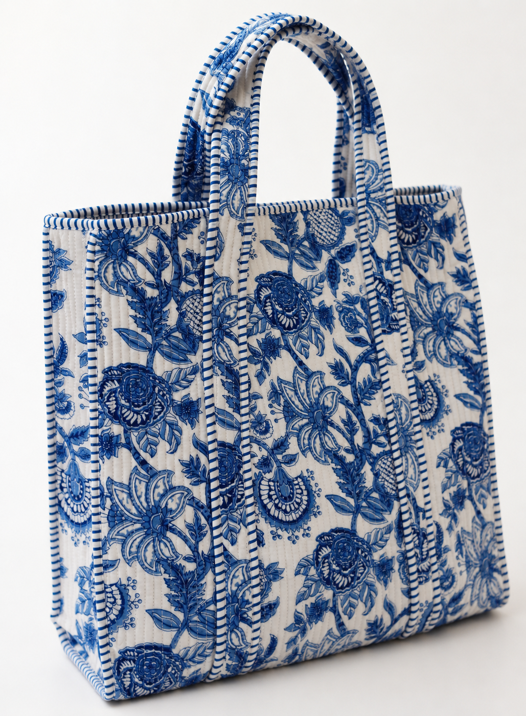  Handprinted cotton batting material on a durable handmade quilted tote bag.