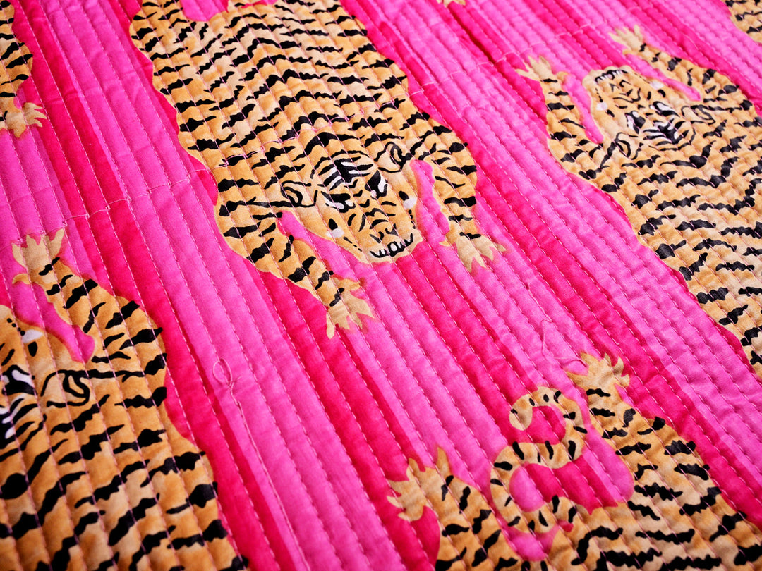 Quilted cotton fabric featuring tiger stripe print, versatile for making tote bags, zippered pouches, and fashion accessories.