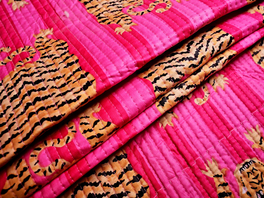 Animal print quilted fabric with tiger stripes, ideal for sewing stylish tote bags, pouches, and accessories