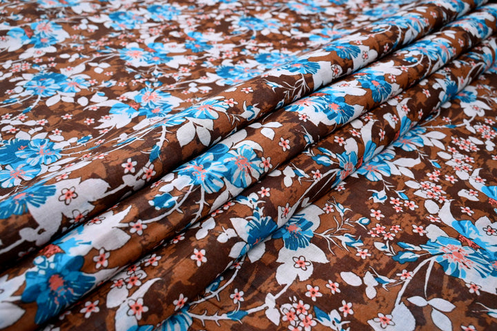 Blue white floral print on brown fabric